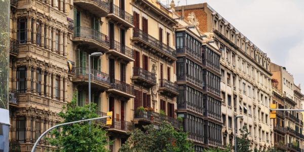 Row of old buildings made in classic style in Barcelona, Spain
